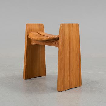 A solid pine stool by Gilbert Marklund, Furusnickarna AB.