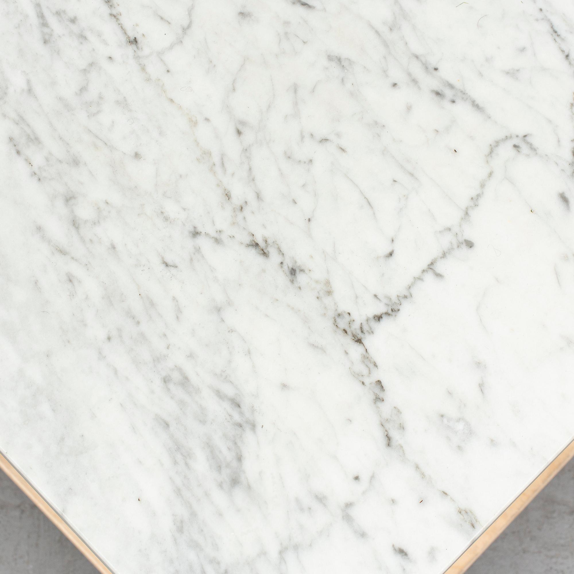 JOSEF FRANK, a model 2125 marble top coffee table from Svenskt Tenn.