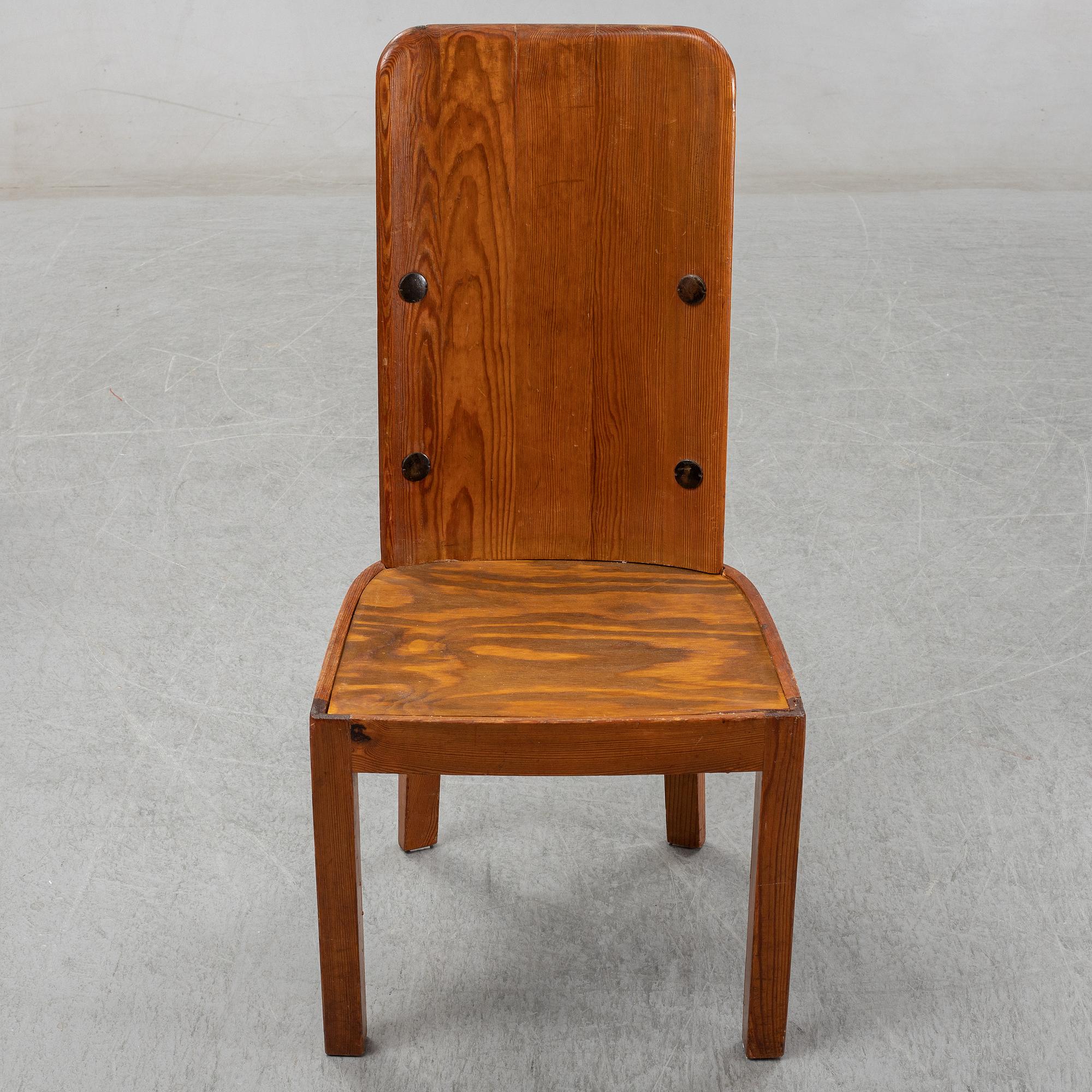 Axel Einar Hjorth, a pair of stained pine "Lovö" chairs, Nordiska Kompaniet, Sweden 1930's.