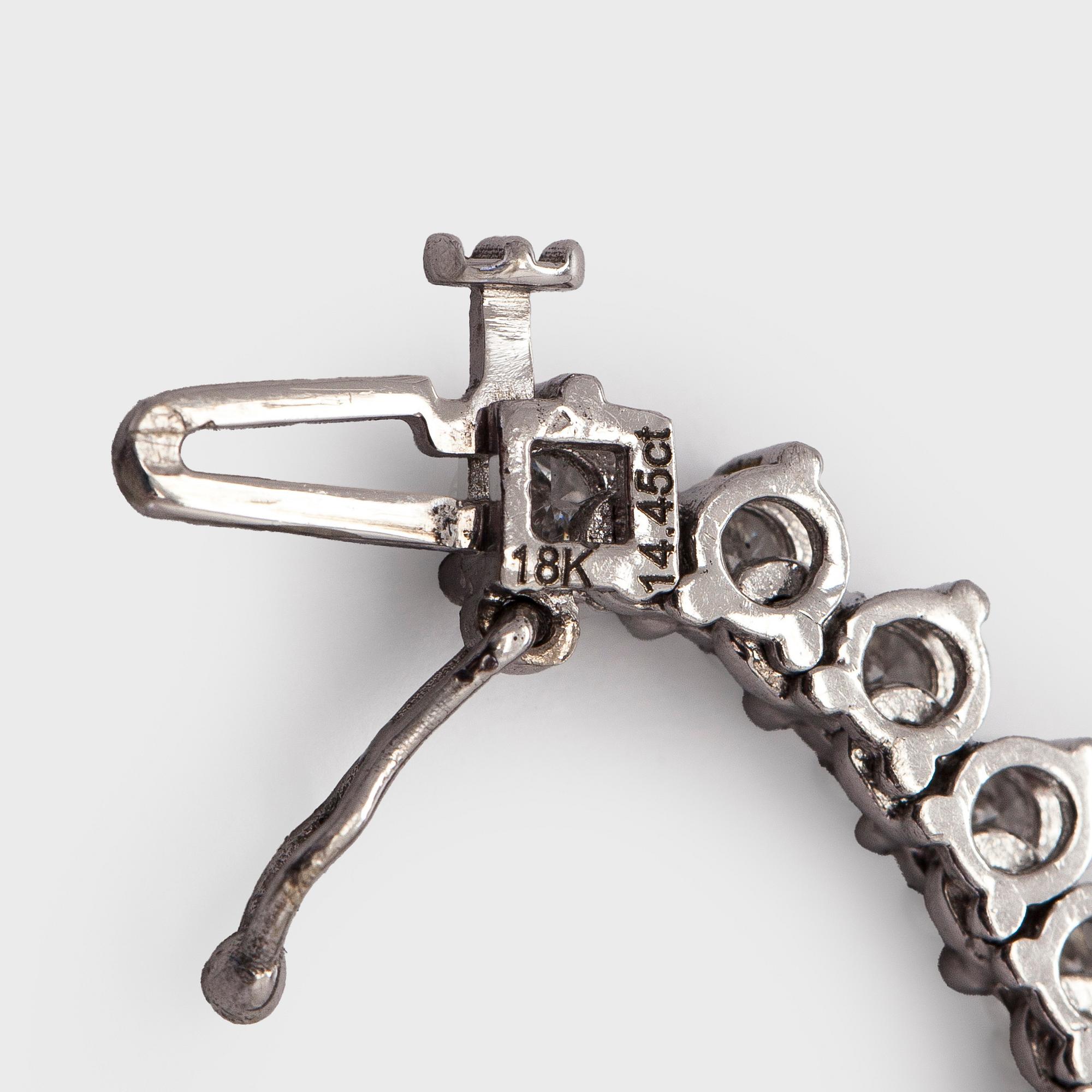 Kaulakoru, 18K valkokultaa ja briljanttihiottuja timantteja.