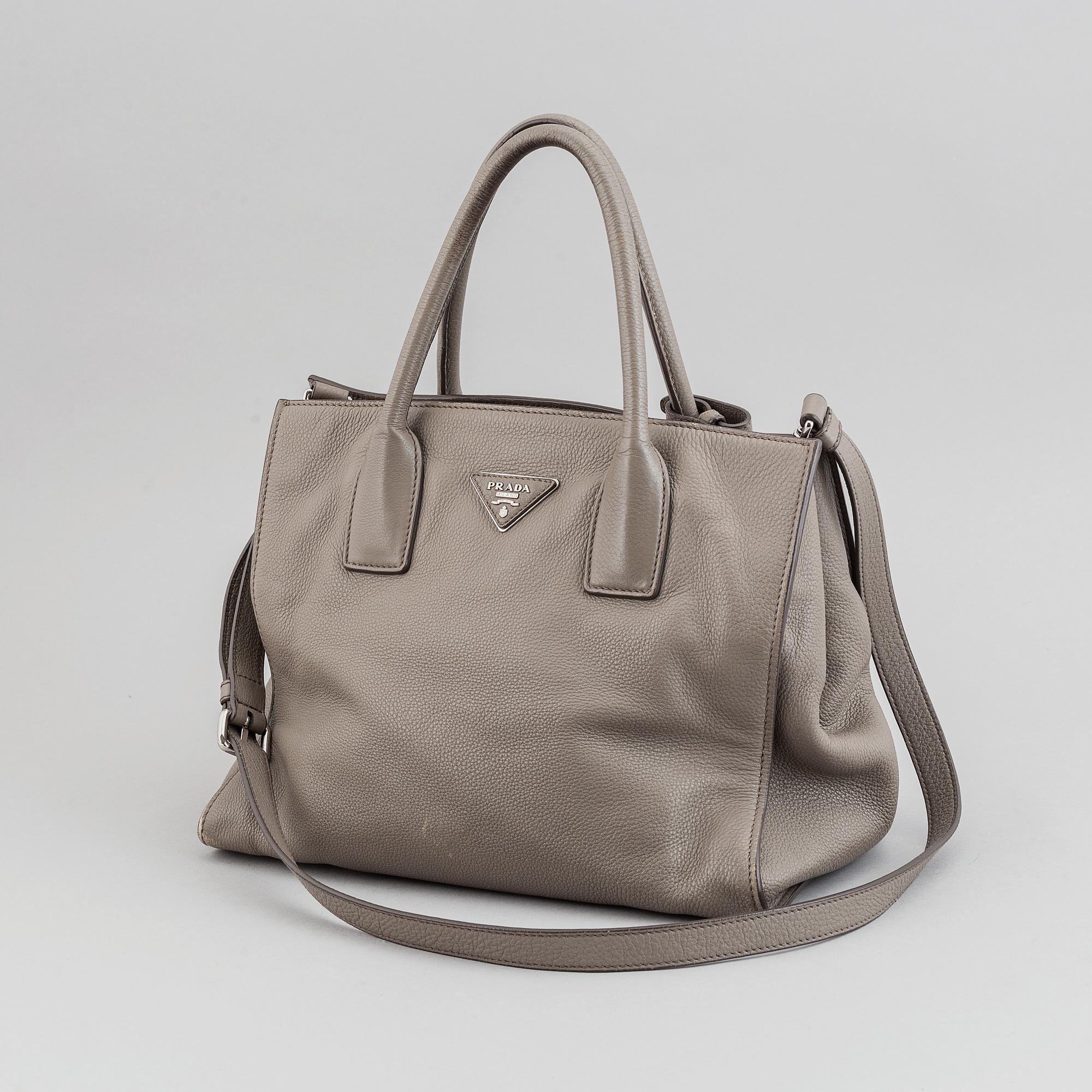 Prada, a leather handbag.