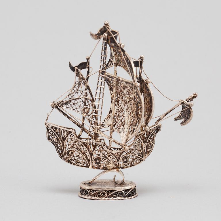 A 20TH CENTURY SILVER MINIATURE SAILING SHIP.