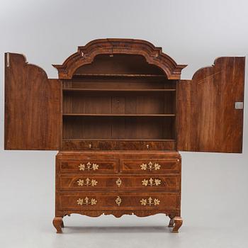 A rococo walnut parquetry cabinet, Stockholm, later part of the 18th century.