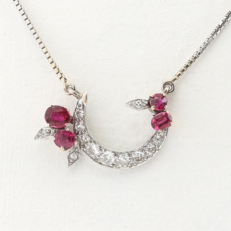 Necklace 18K white gold with faceted rubies and diamonds.