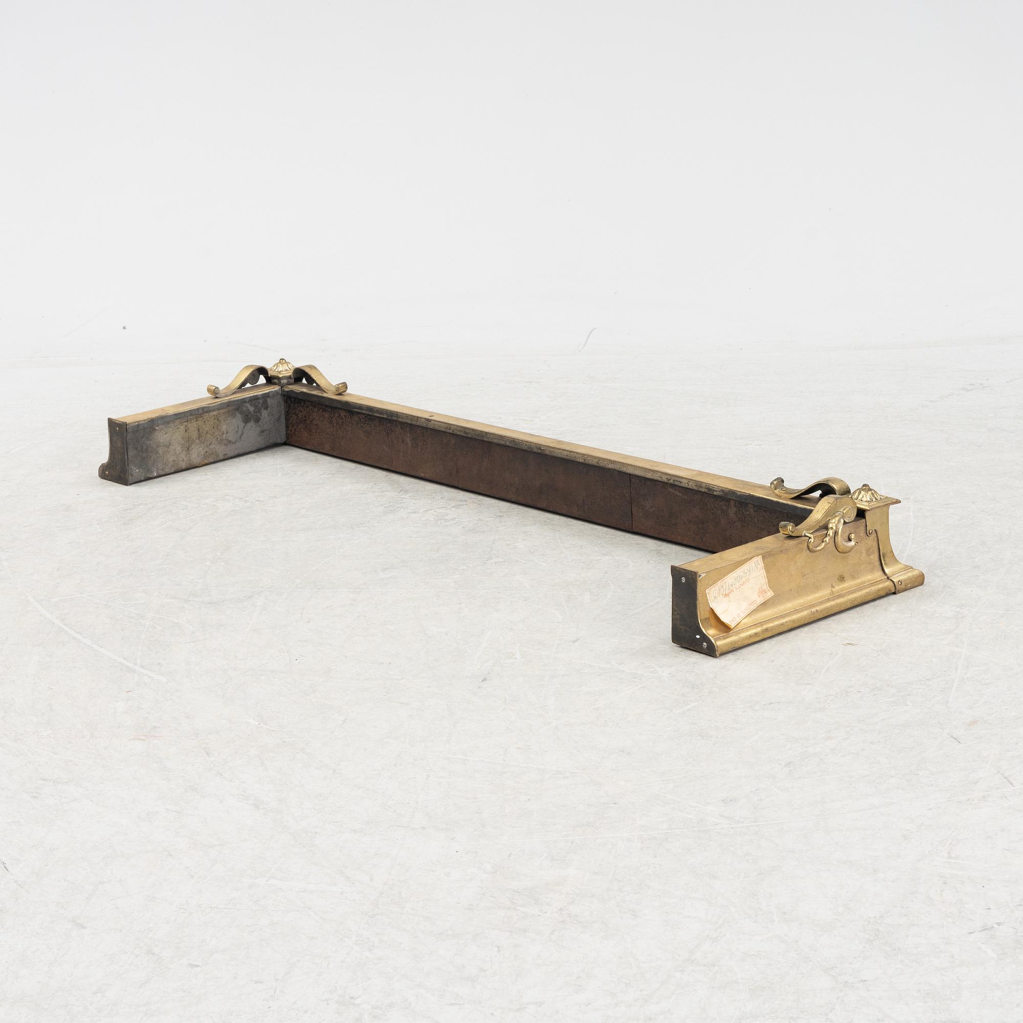 A brass fire guard, around 1900.