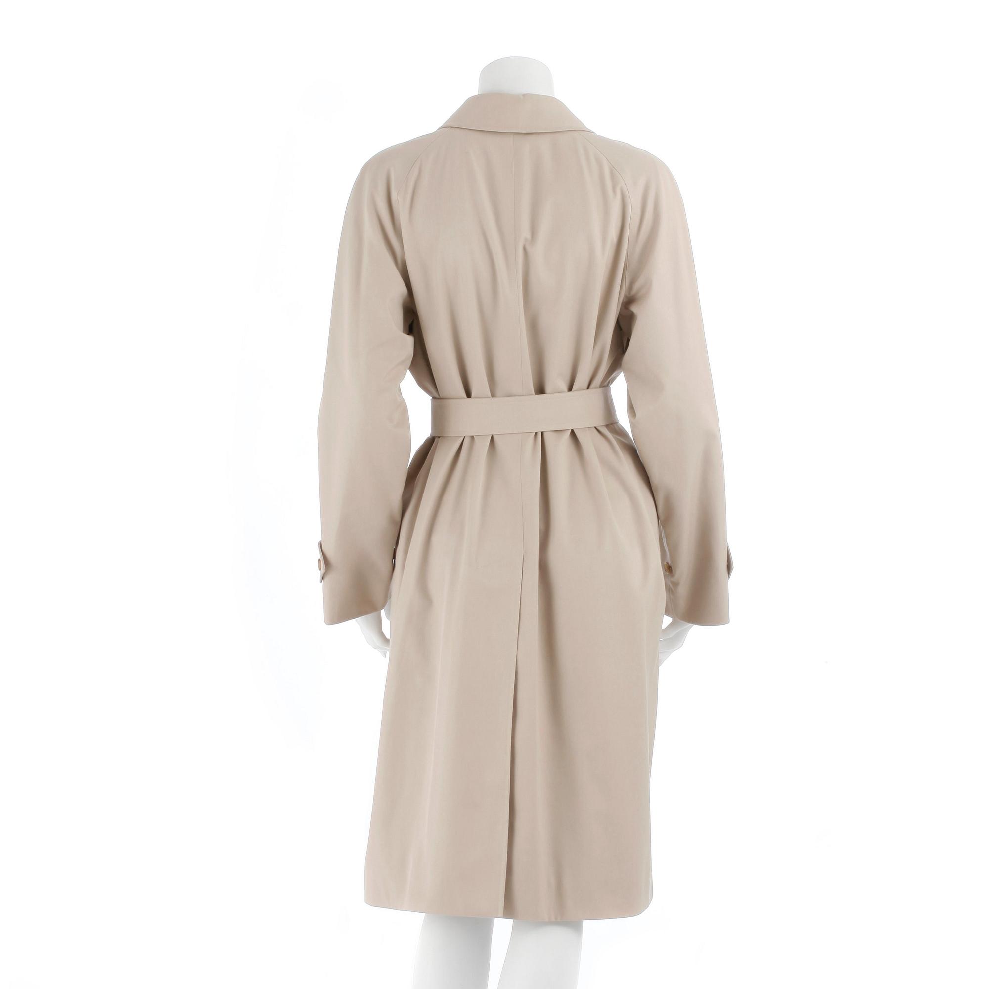 BURBERRY, a beige cotton blend trench coat and a shawl.