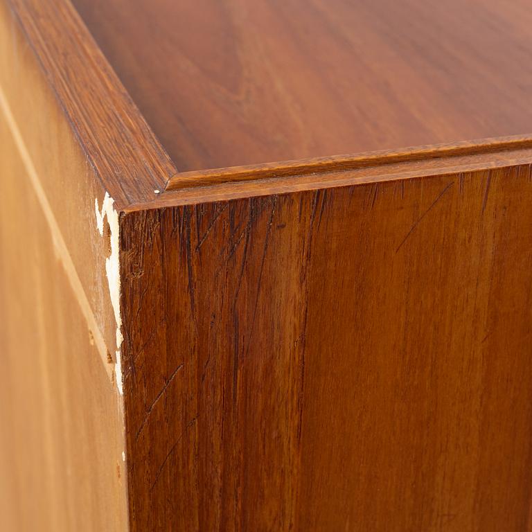 A teak-veneered mid 20th century sideboard.