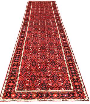A Hosseinabad runner, c 414 x 95 cm.