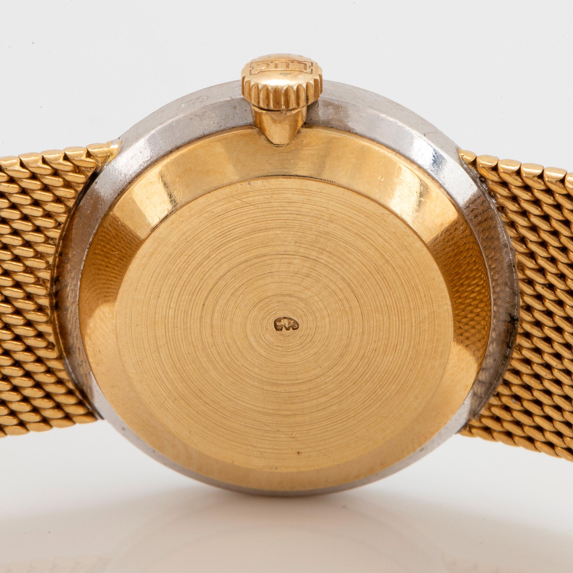 A Chopard wrist watch in 18K gold set with eight-cut diamonds.