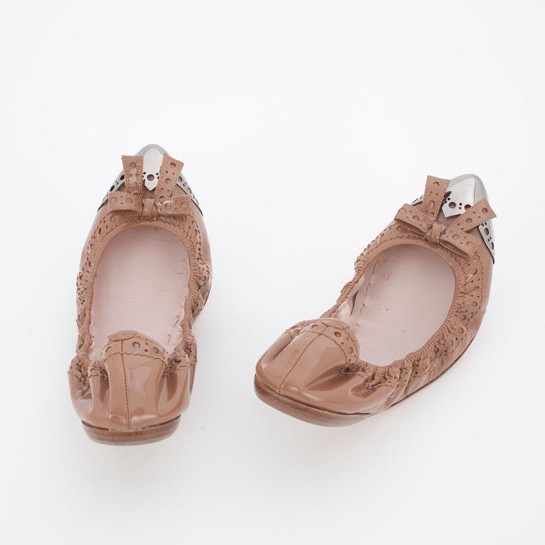 MIU MIU, a pair of leather ballet flats.