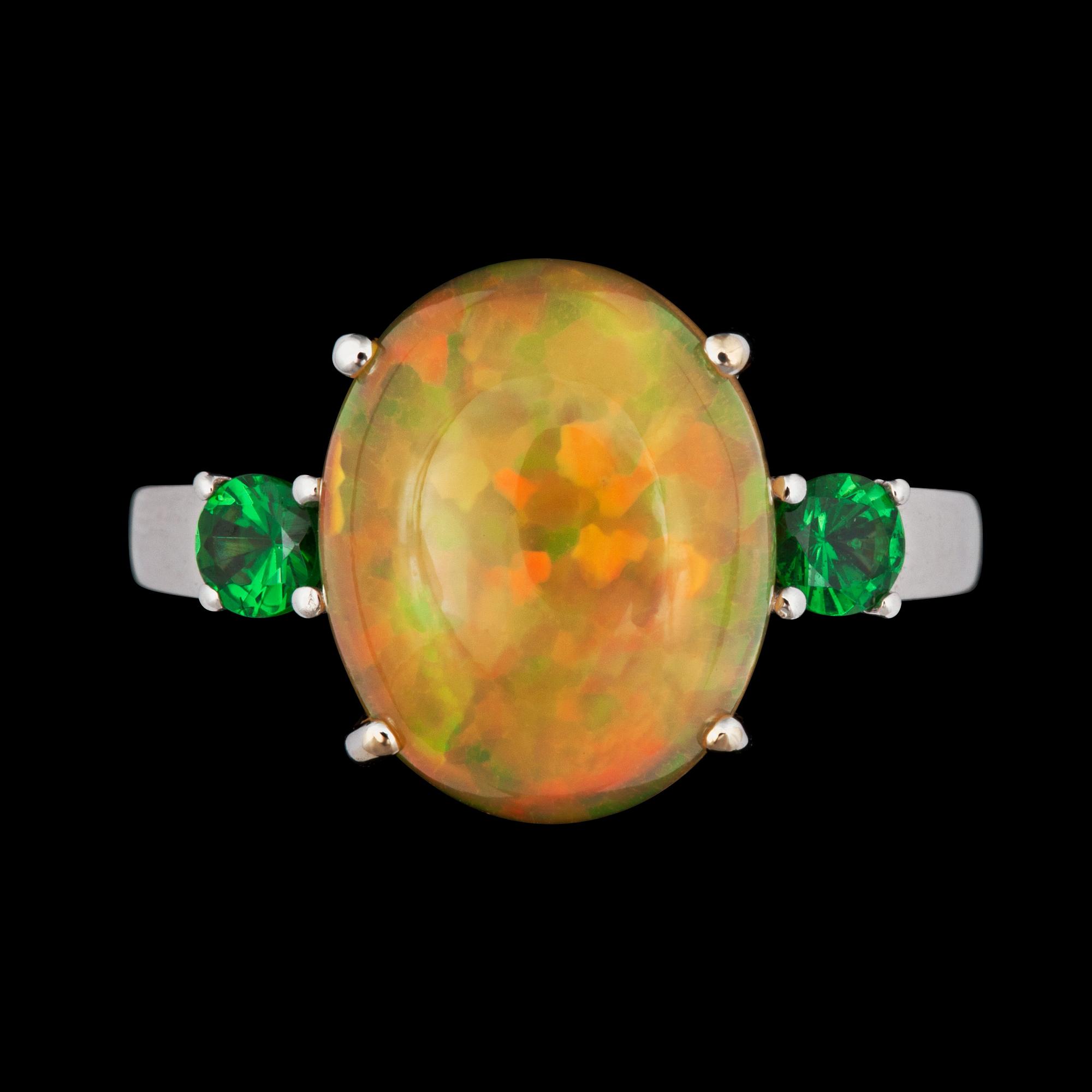 A 4.26 cts Ethiopian fire opal and 0.40 ct tsavorite garnet ring.