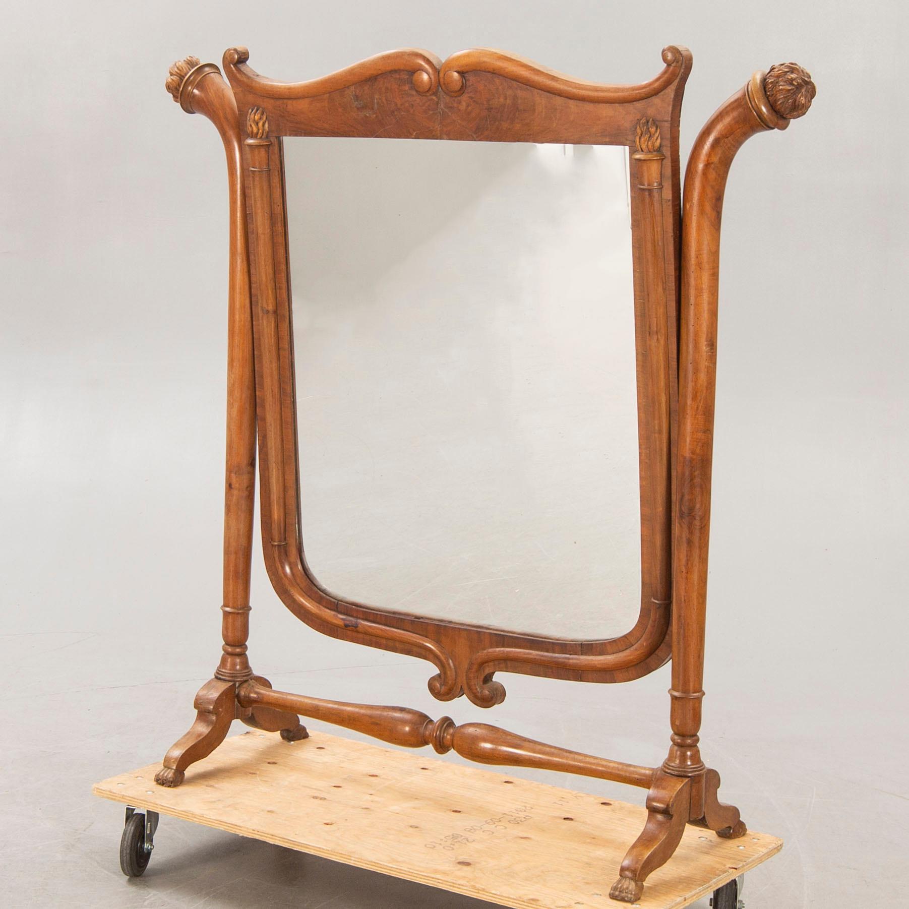 A late 19th century walnut floor mirror.