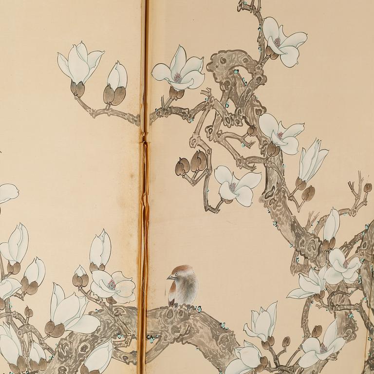 A 20th century folding screen.