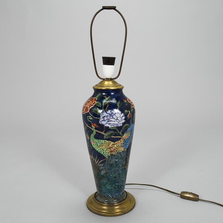 A painted porcelain table lamp, later part of the 20th century.