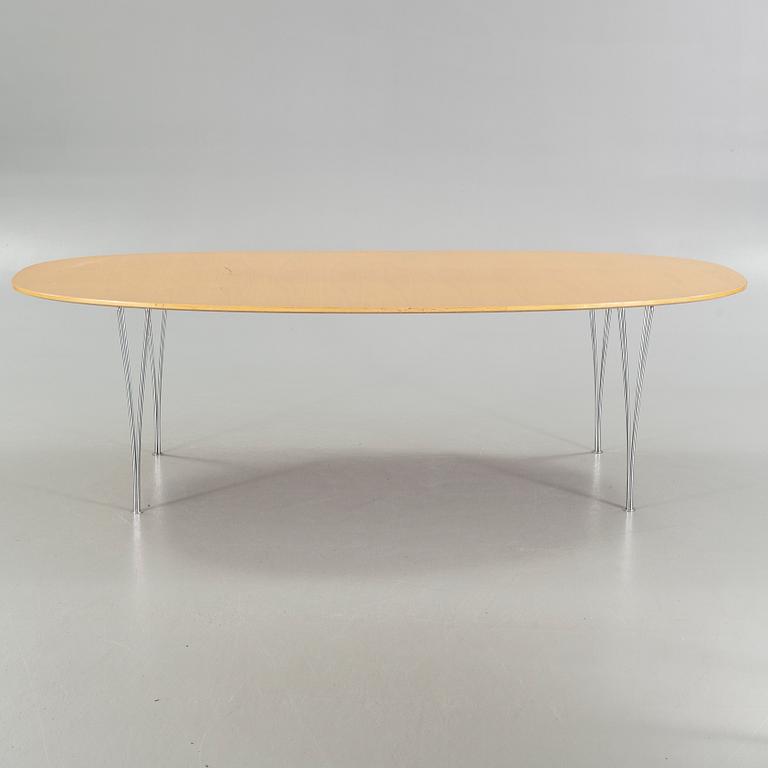 A "Superellips" table by BRUNO MATHSSON and PIET HEIN made by Fritz Hansen in 1980.