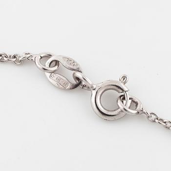 COLLIER/BROSCH, med rosen- och gammalslipade diamanter.