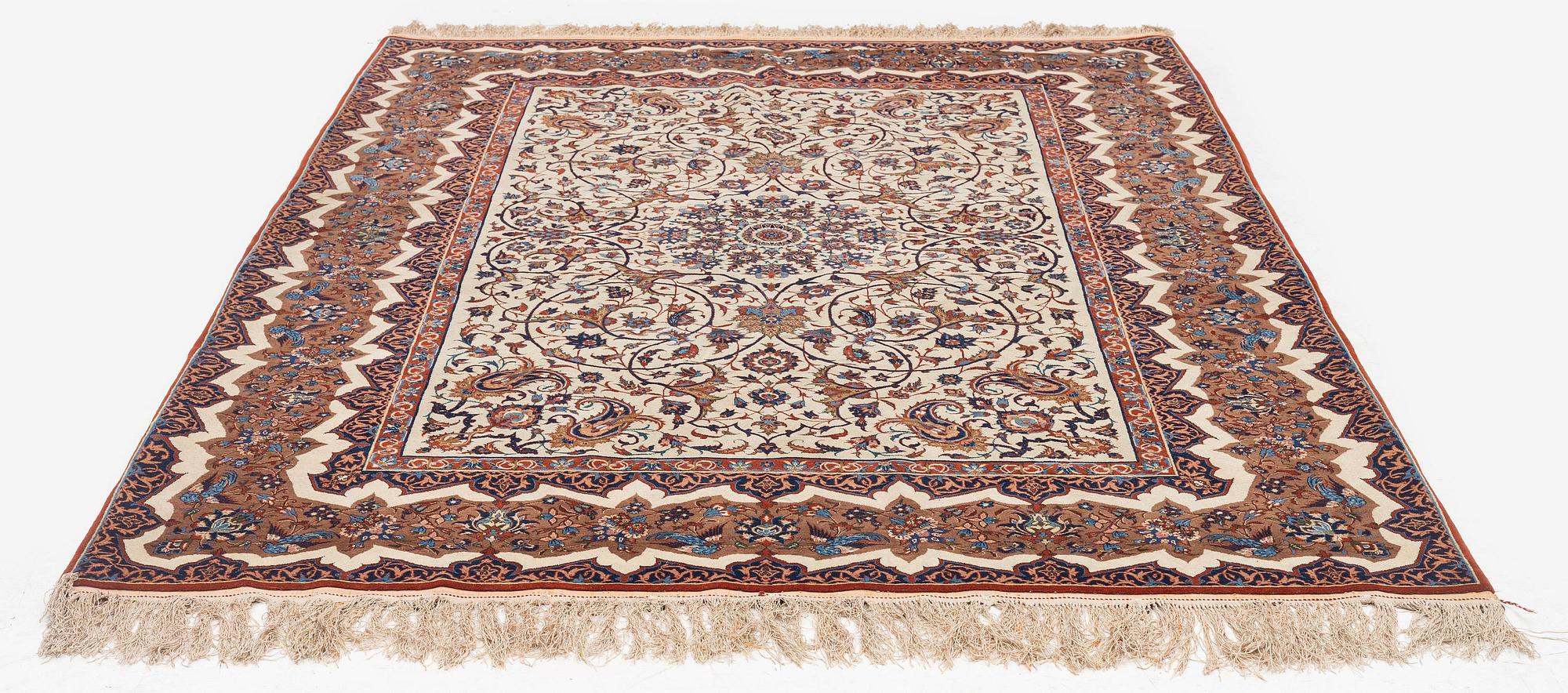 An antique Isfahan rug, Central Iran, c. 228 x 139 cm.