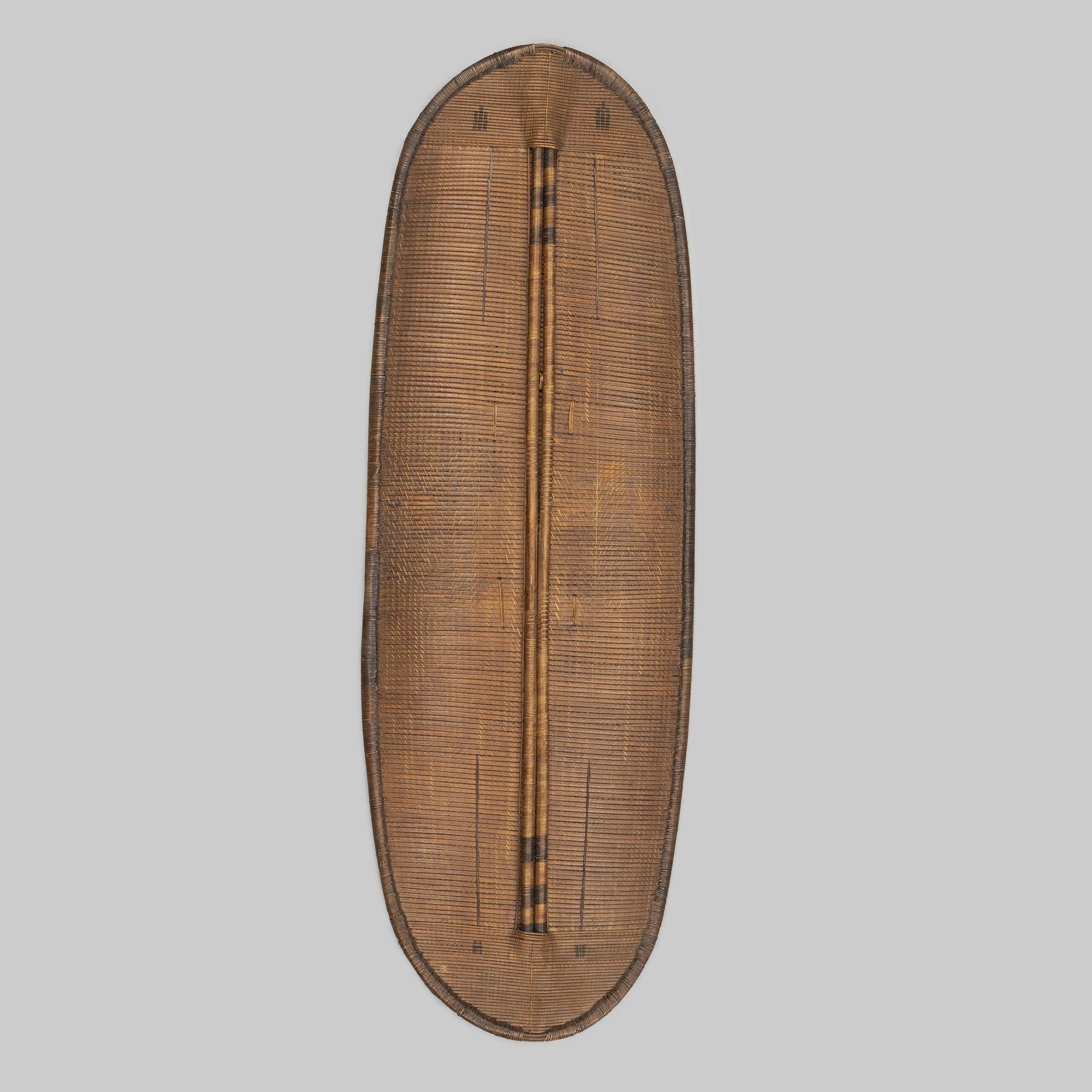 An early 20th Century rattan shield, Mongo-Ngandu, DRC.