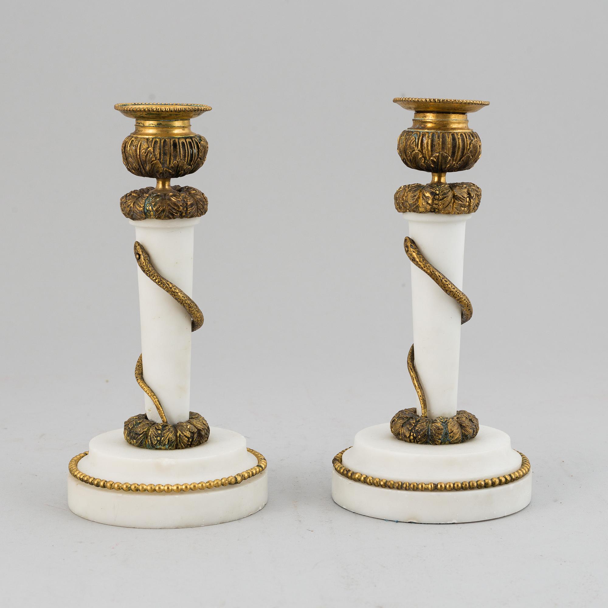 A pair of Louis XVI style candle sticks, circa 1900.