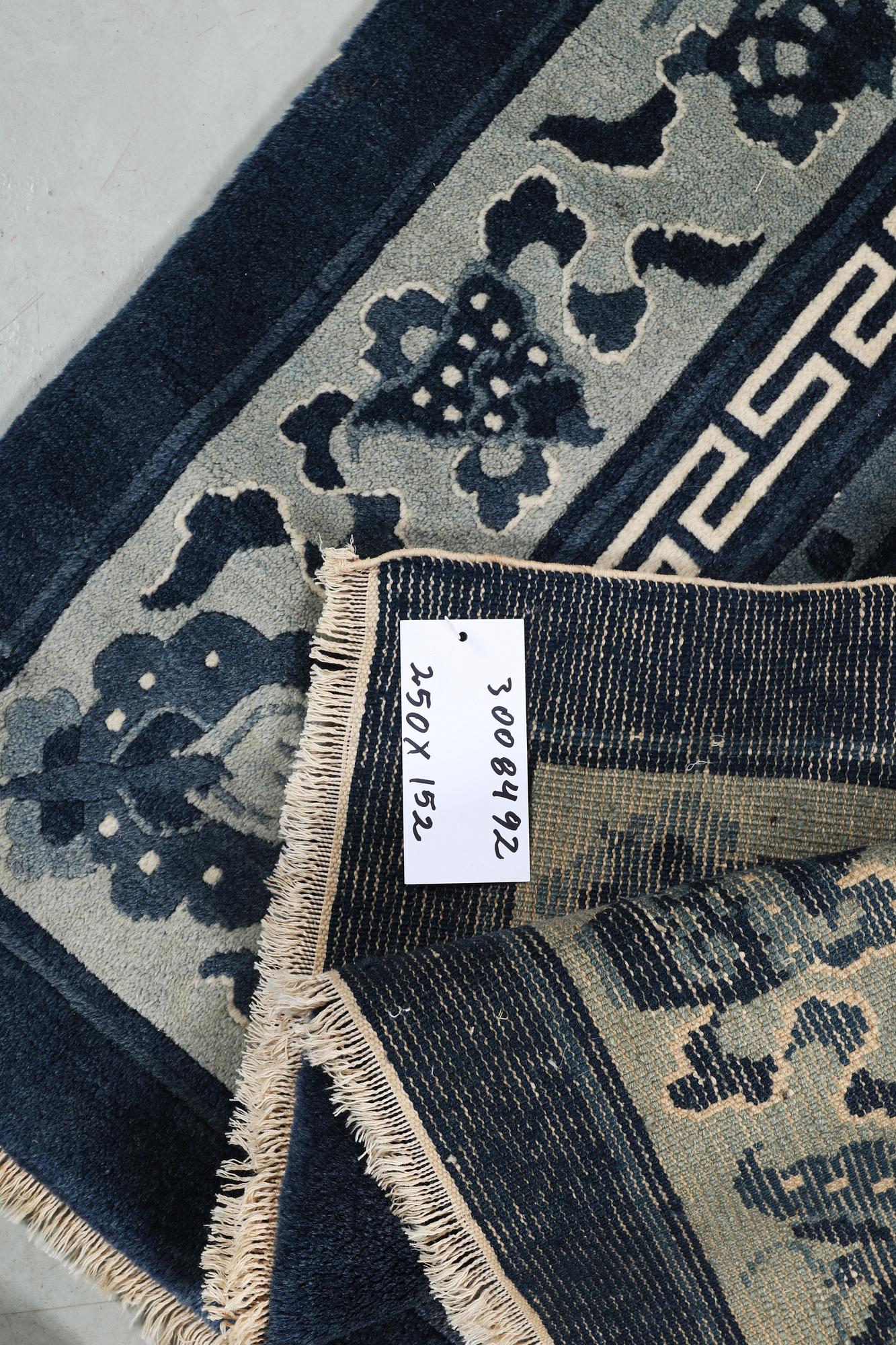 A carpet, China, Antique Finish, ca 250 x 152 cm.