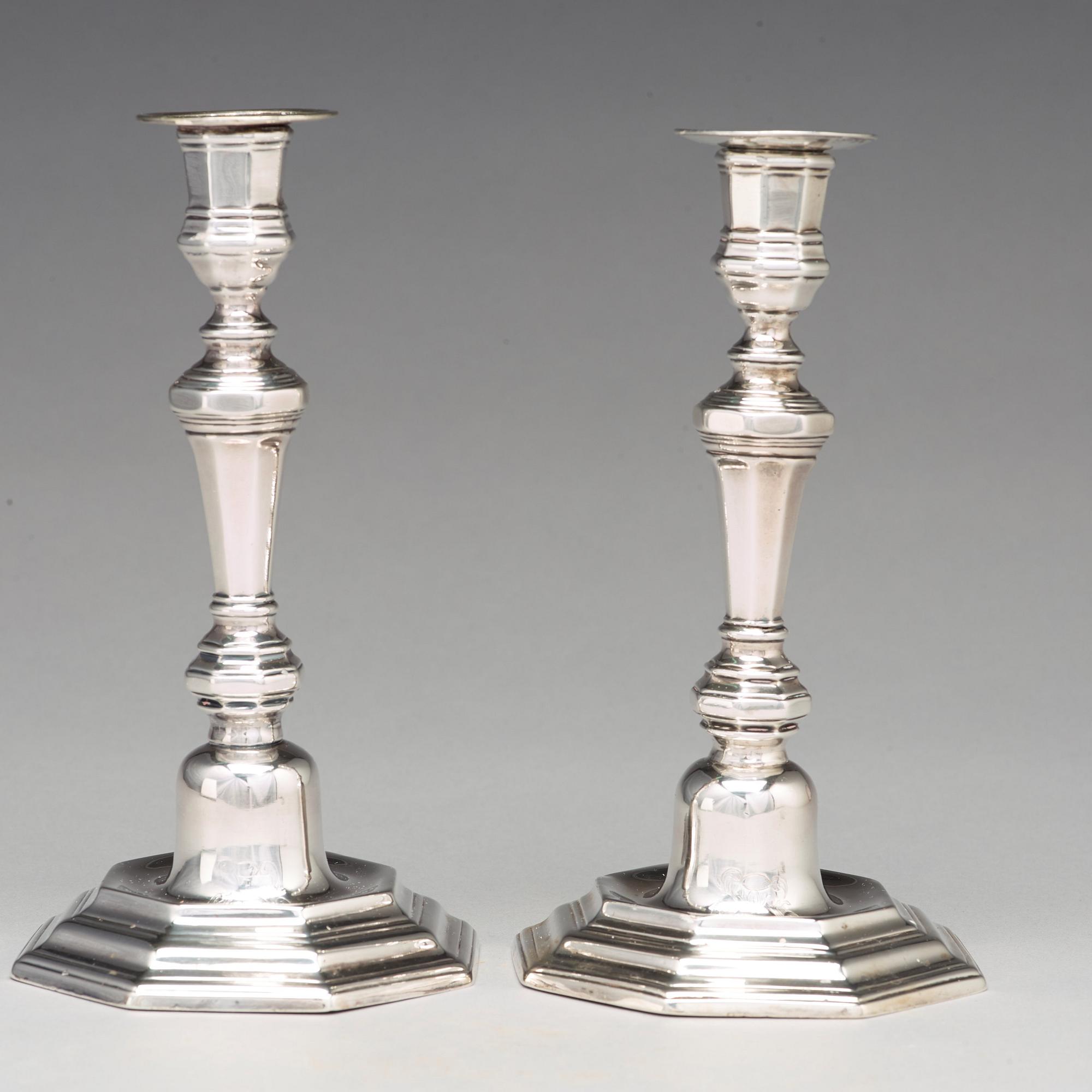 A pair of European 18th century silver candlesticks, unidentified makers mark.