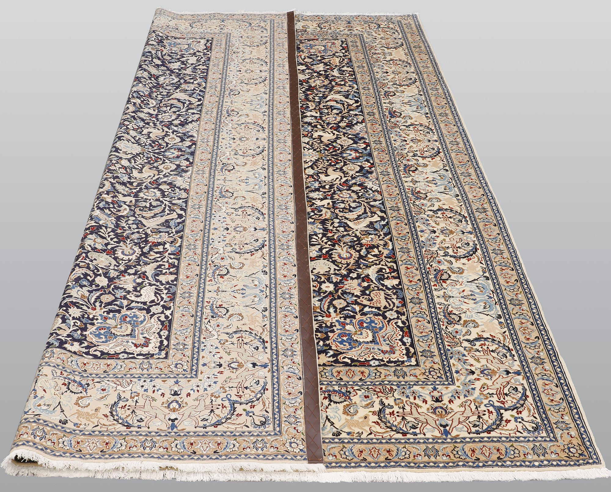 A Nain carpet, part silk, so-called 6 LAA, approx. 324 x 210 cm.