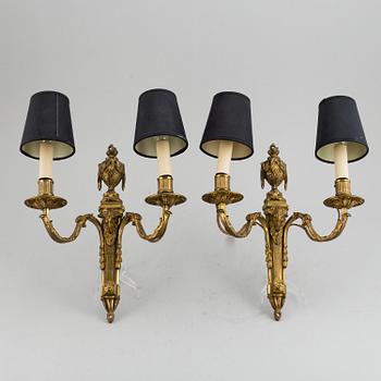 A pair of Louis XVI style wall sconces.