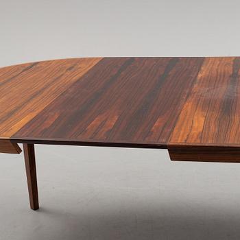 A 1950s/1960s rosewood veneer table.