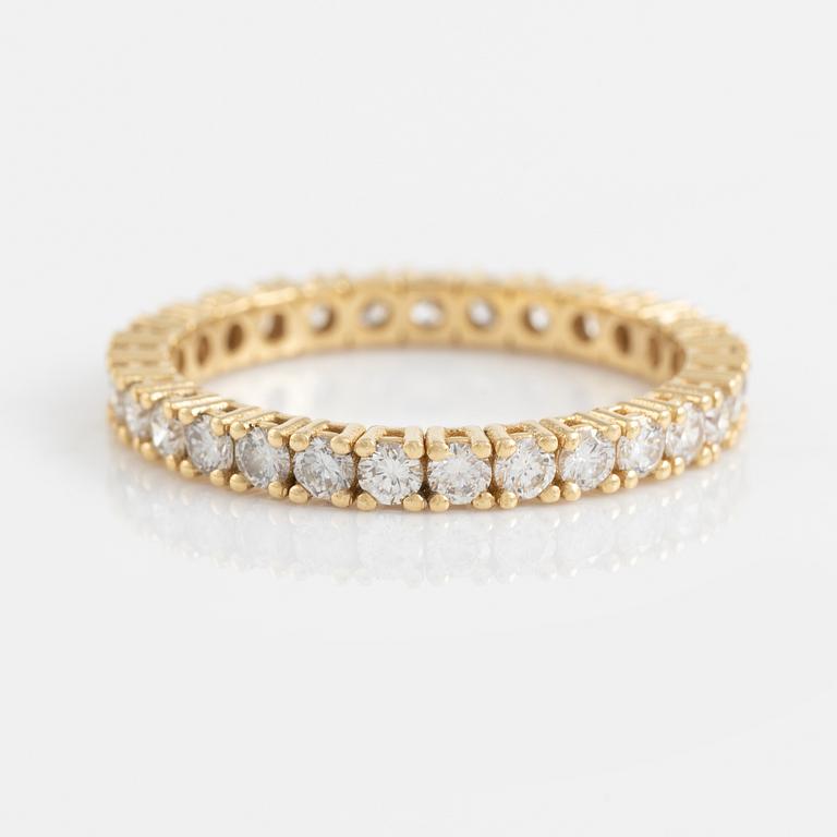 Brilliant cut diamond eternity ring.