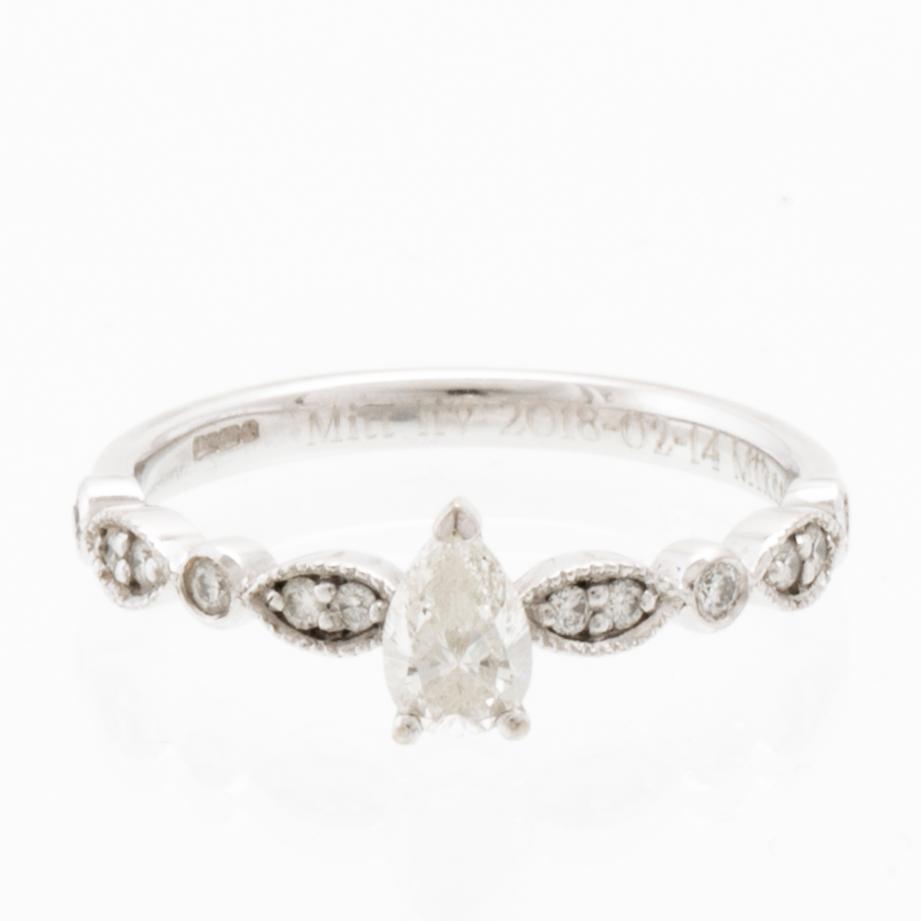 Ring in 18K white gold set with a pear-shaped diamond and round brilliant-cut diamonds, Van Bruun.