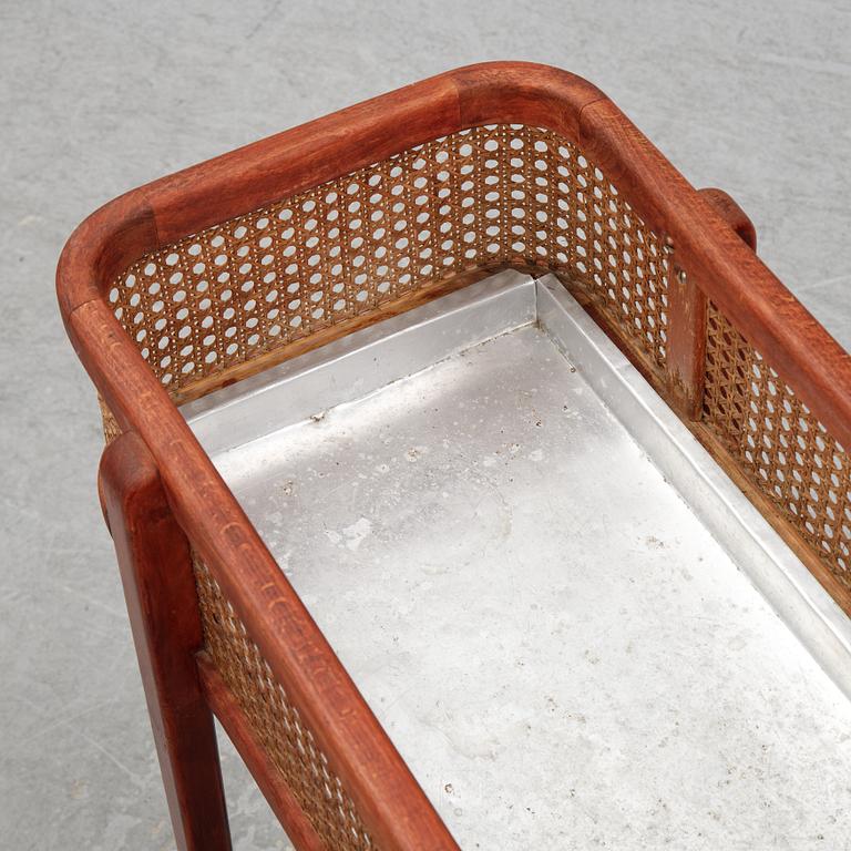 A flowertable with rattan details, late 20th century.