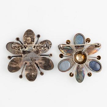 Two brooches, silver, one by Rey Urban, flower-shaped.