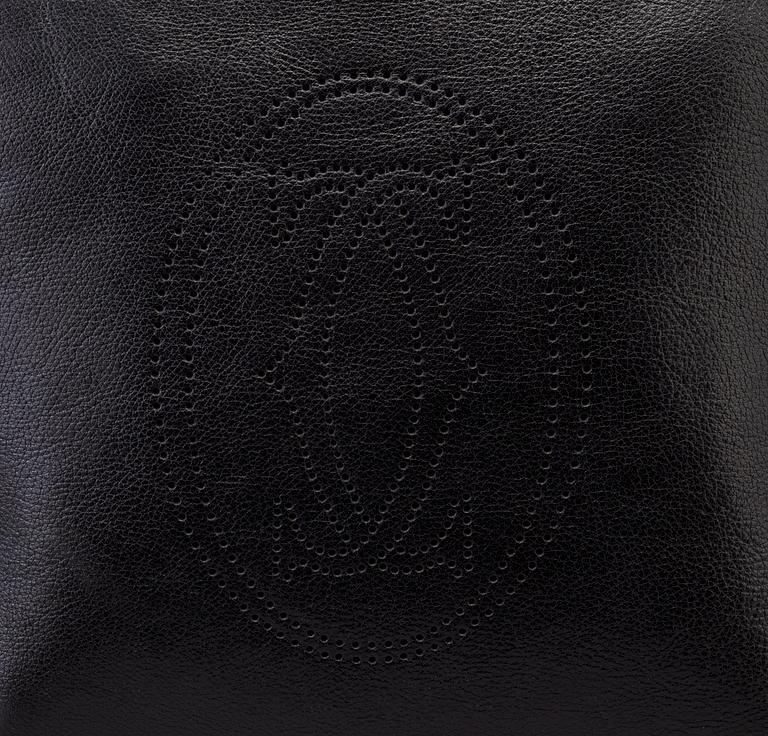 A bag "Marcello Reporter" by Cartier.