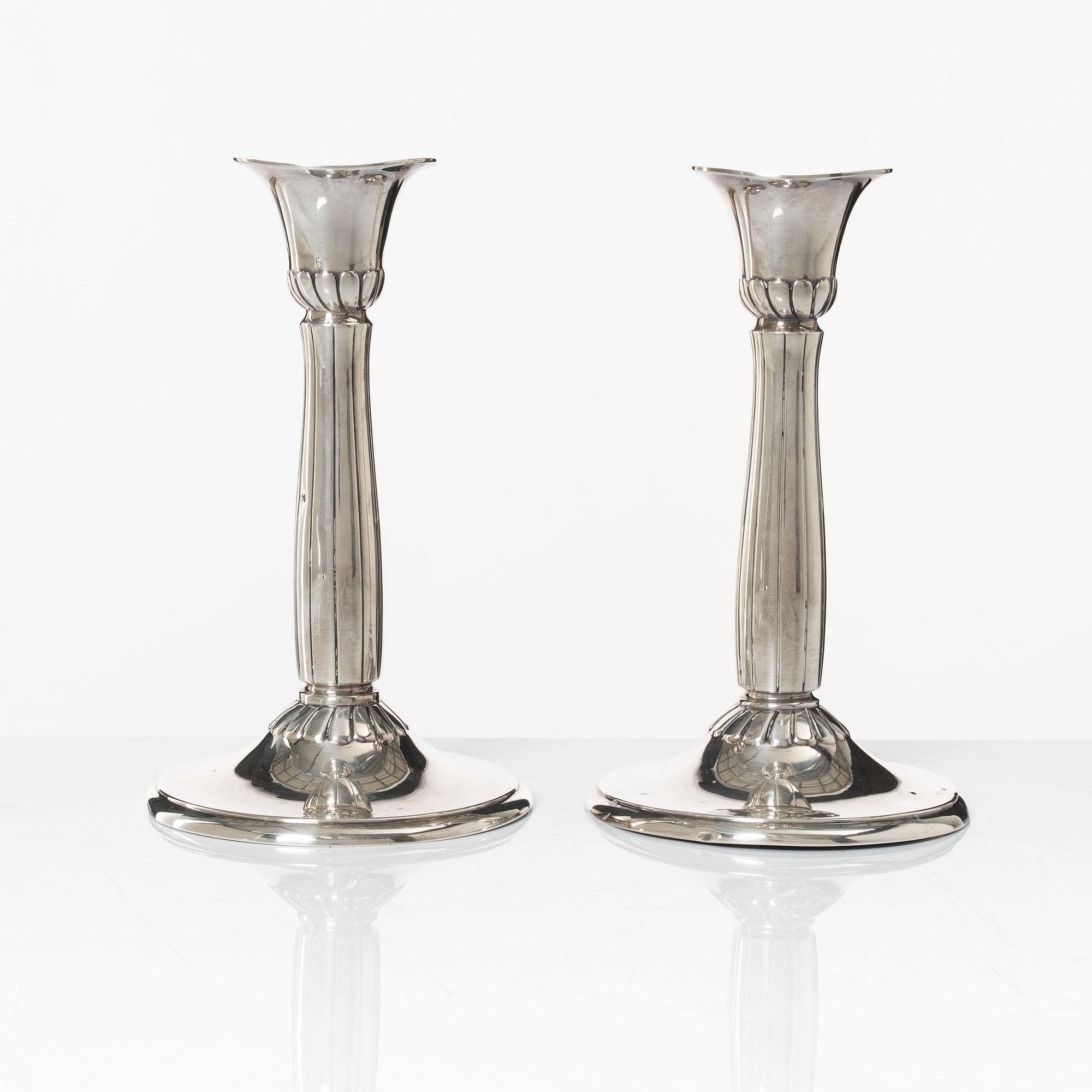 A pair of silver candle sticks, first half of the 20th century.