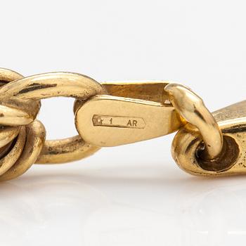 An 18K gold necklace. Unoaerre, Italy.