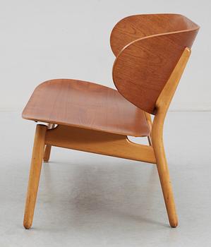 A Hans J Wegner teak and beech 'Shell' settee by Fritz Hansen, Denmark, 1950's.