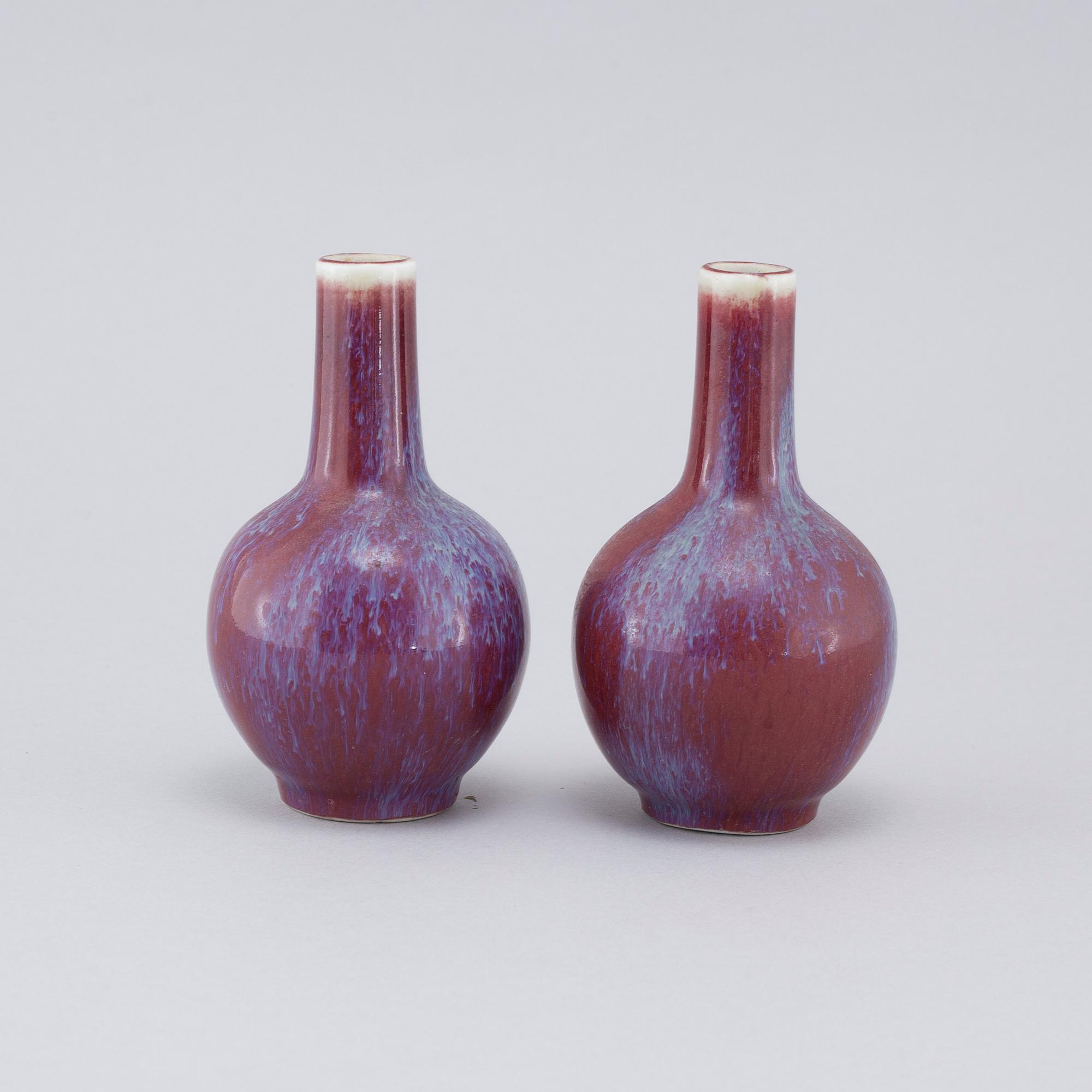 A pair of sang de boeuf vases, 20th cenutry.