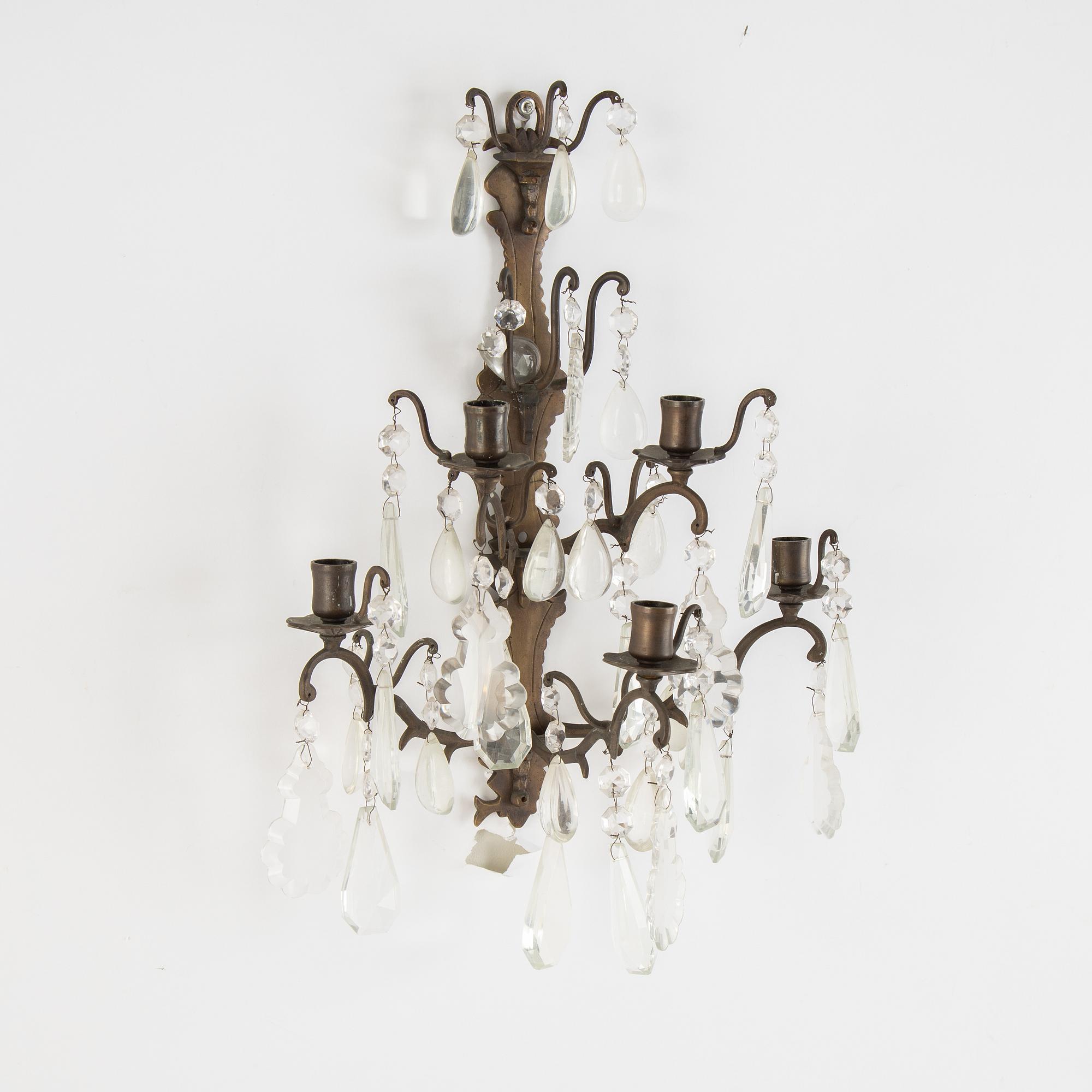 A pair of brass and cut glass five-light  baroque-style wall lights.