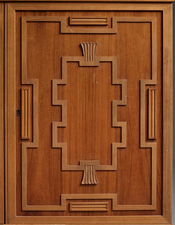 A Swedish Grace mahogany showcase cabinet, reportedly a win at the Stockholm Cabinetmaker's association lottery, 1920's.