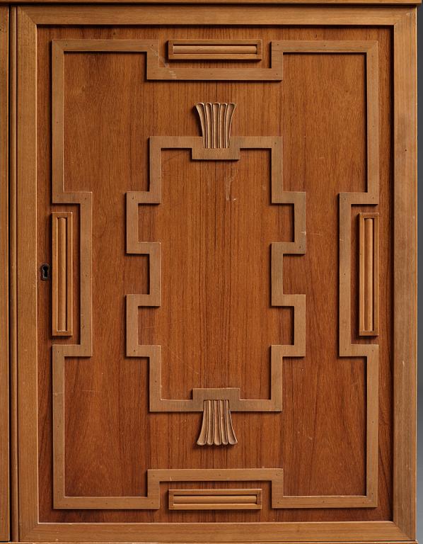 A Swedish Grace mahogany showcase cabinet, reportedly a win at the Stockholm Cabinetmaker's association lottery, 1920's.