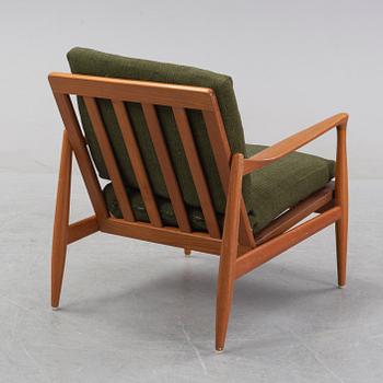 A 1950's/60's teak and oak easy chair.