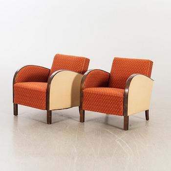 A pair of 1930/40:s Art Deco easy chairs.