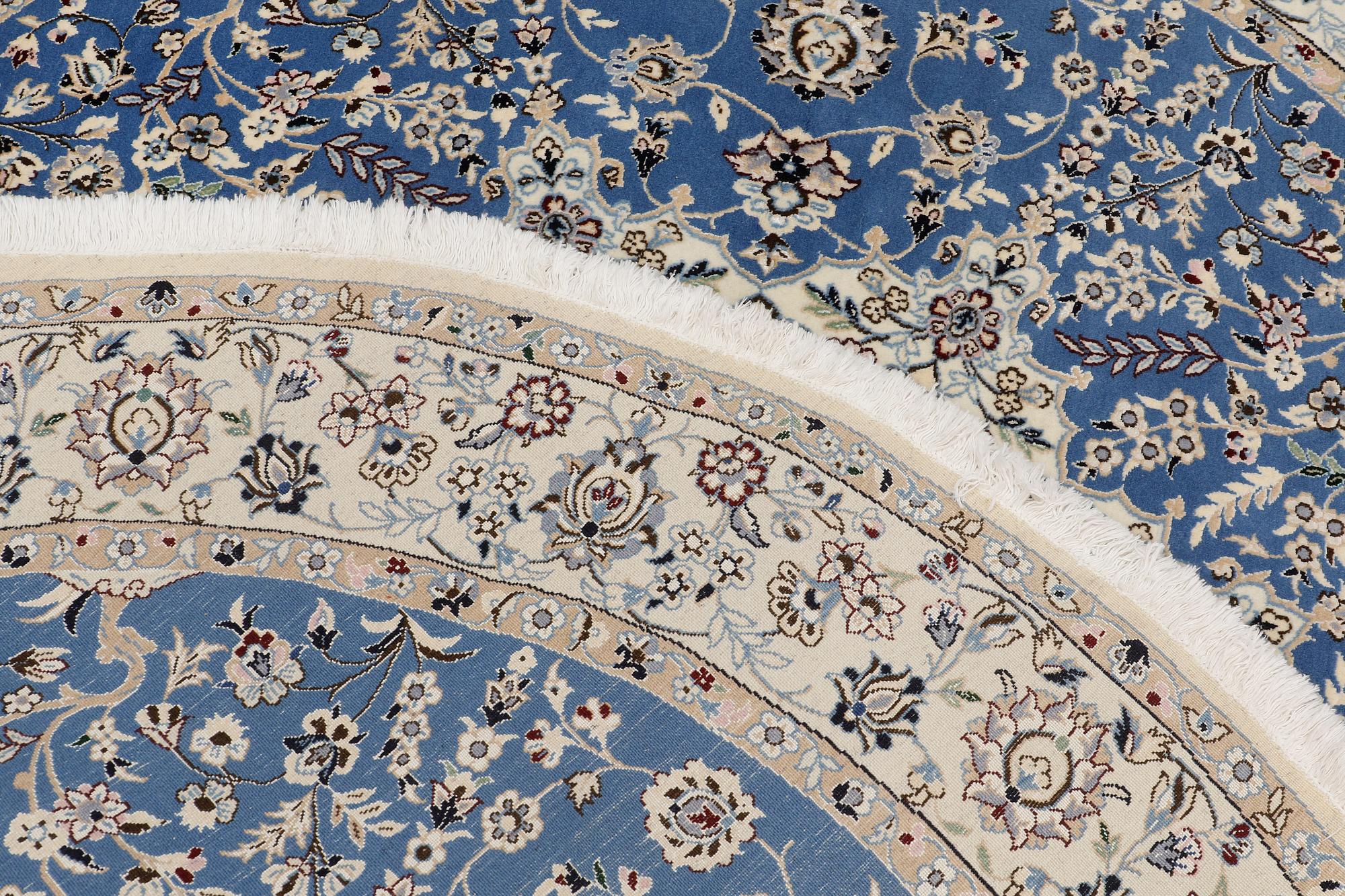 A round part silk Nain rug, so called 9 LAA, diameter 195 cm.