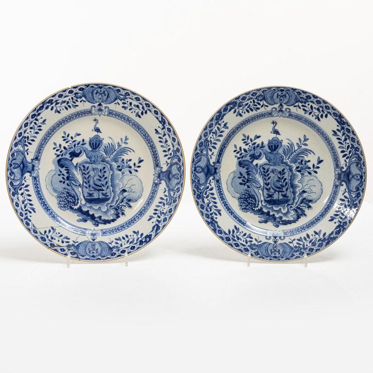 A pair of armorial dinner plates, soft paste, Qing dynasty, 18th century.