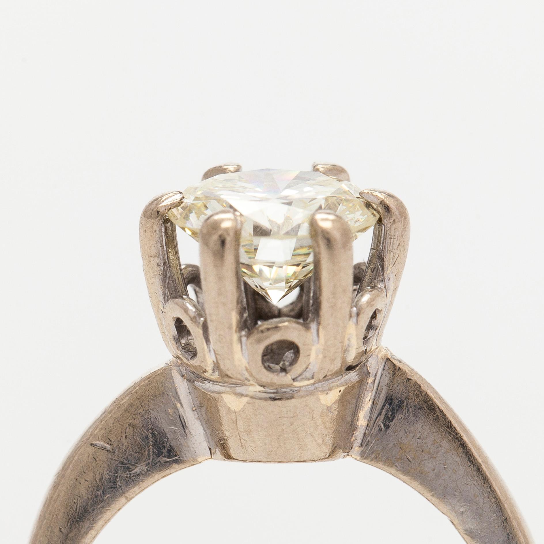 An 18K white gold ring, with a brilliant-cut diamond approximately 1.75 ct. With certificate.