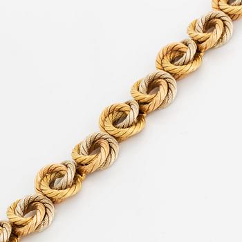 An 18K gold bracelet.