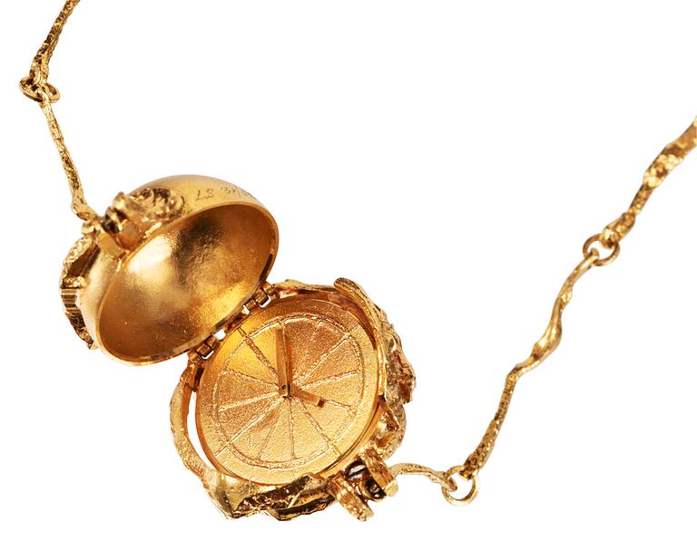 An 18k gold Lapponia pendant (containing a watch) and chain, Finland.