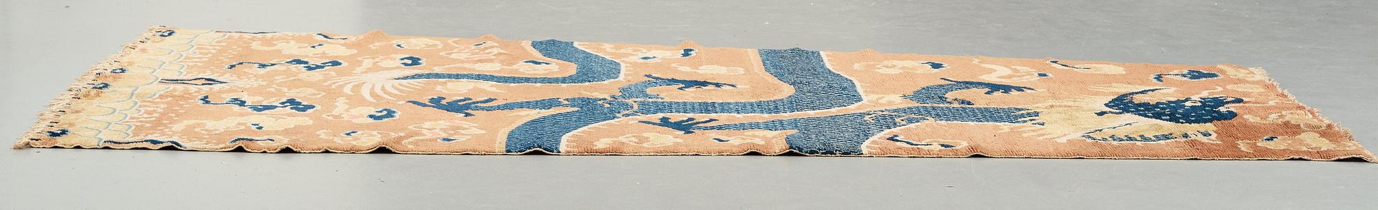 A PILLAR CARPET, an antique Ningxia figural, China late Qing, ca 304 x 130-170 cm.