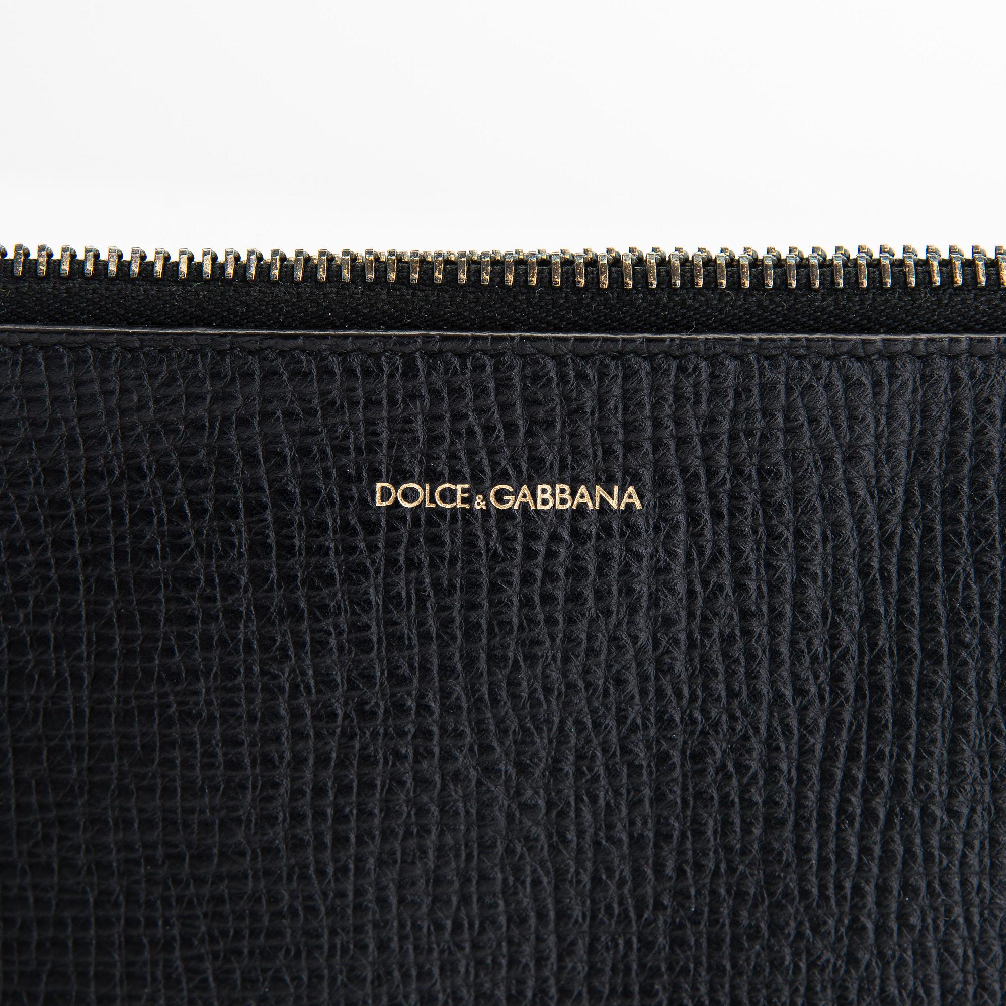 Dolce & Gabbana, portfölj/laptopväska och pouch/clutch.