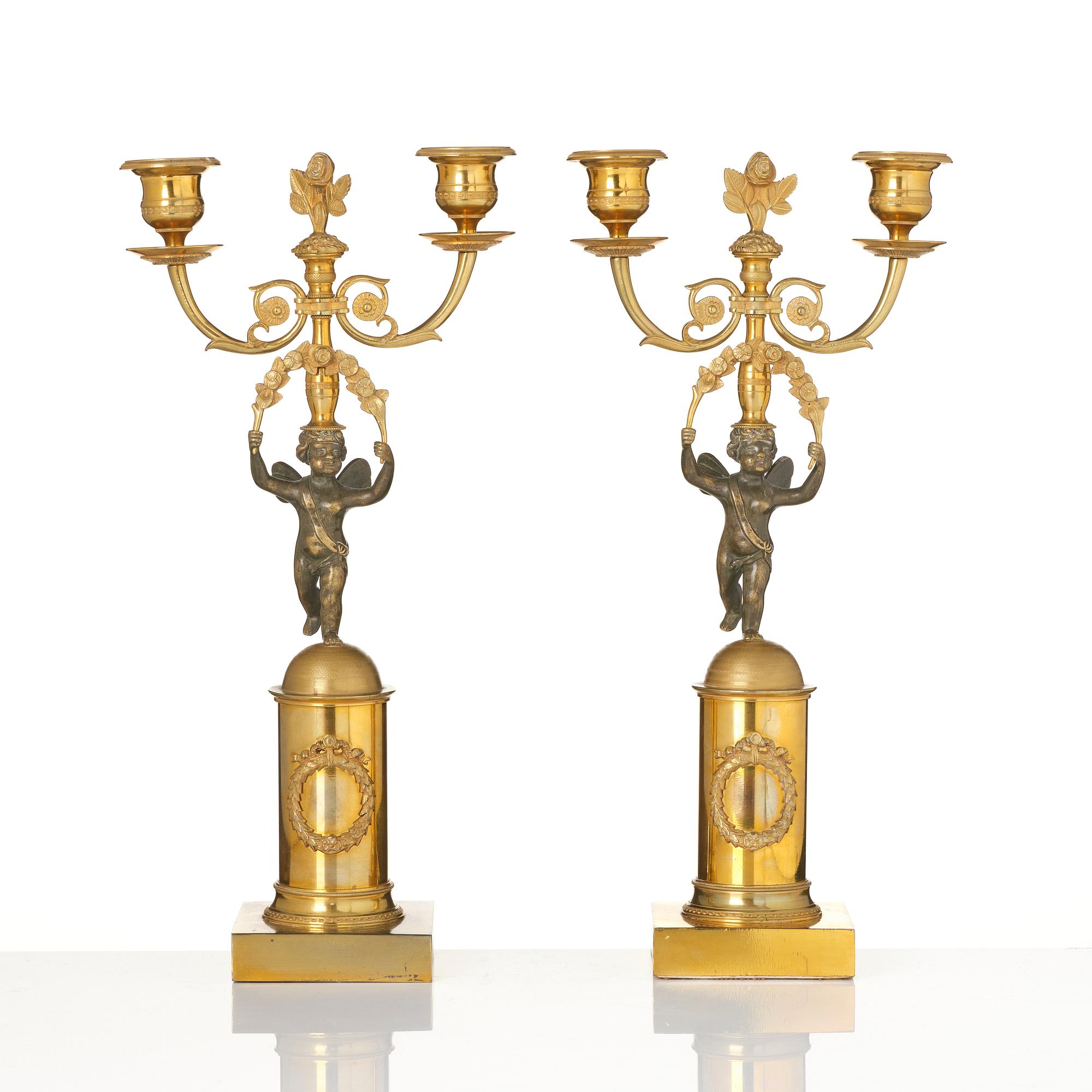 A pair of Empire gilt-brass two-branch candelabra, Stockholm, early 19th century.